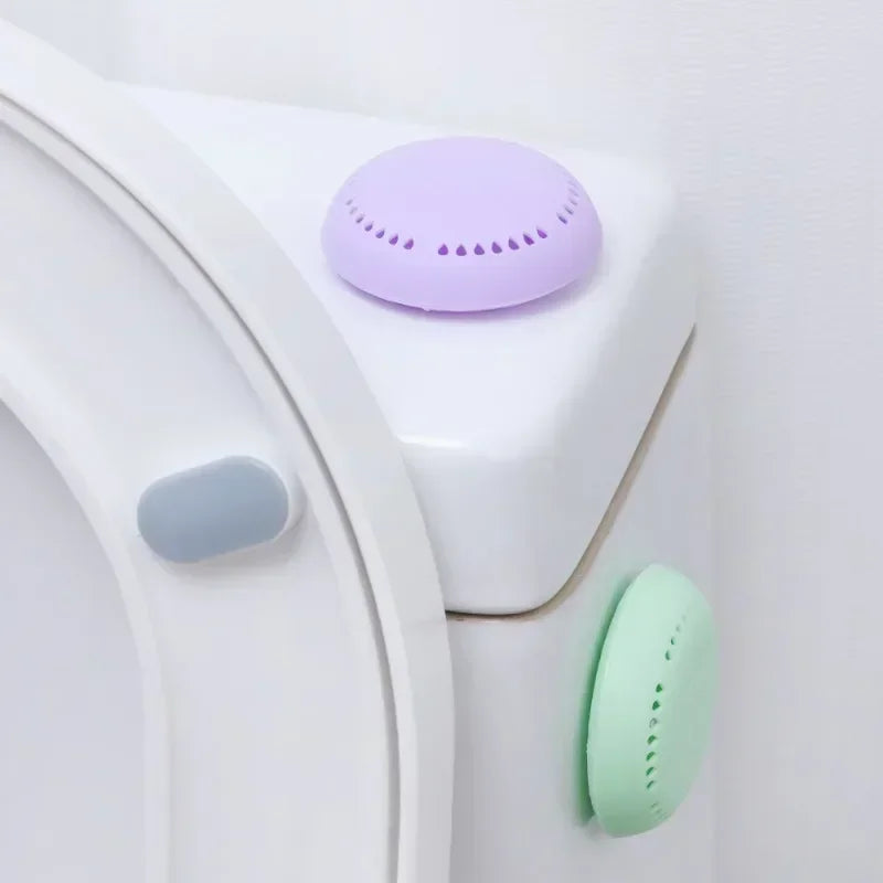 home fragrance solid air freshener in purple and green placed on a toilet tank for freshening up the bathroom.