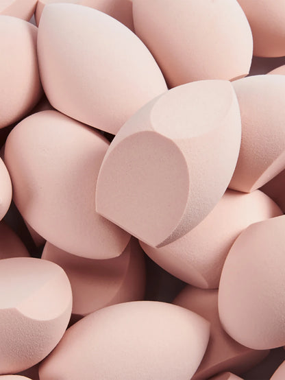 1 Pack Big Size Makeup Sponge Foundation Cosmetic in a pile of soft, pink sponges ideal for makeup application.