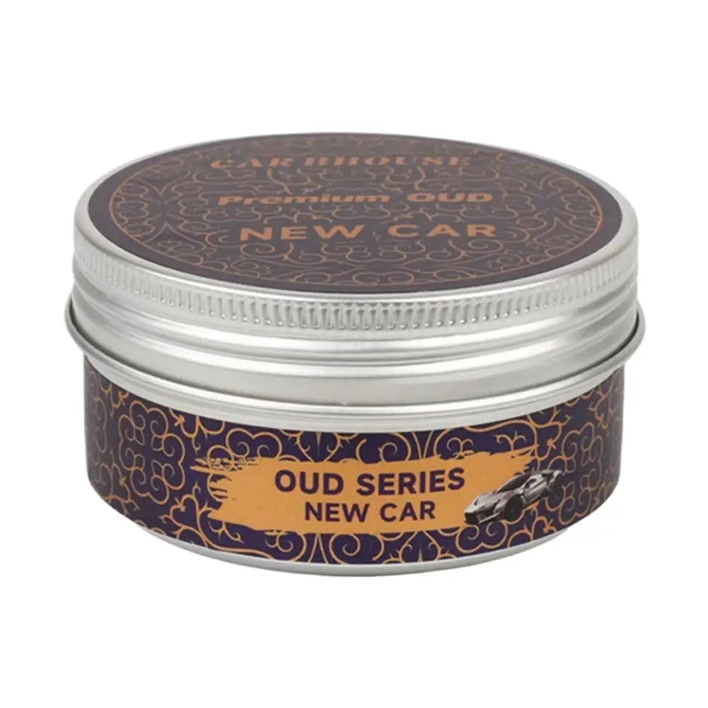 high-end car air freshener in a round metal container labeled &