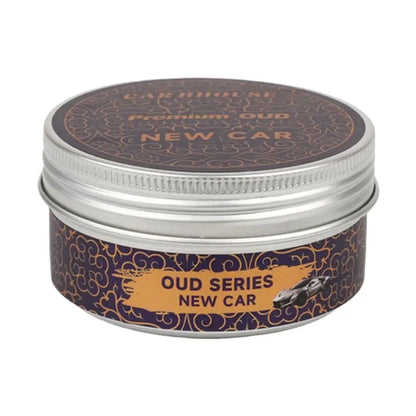 high-end car air freshener in a round metal container labeled &