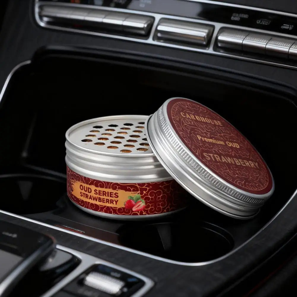 high-end car air freshener in a car cup holder, featuring oudh series strawberry scent.