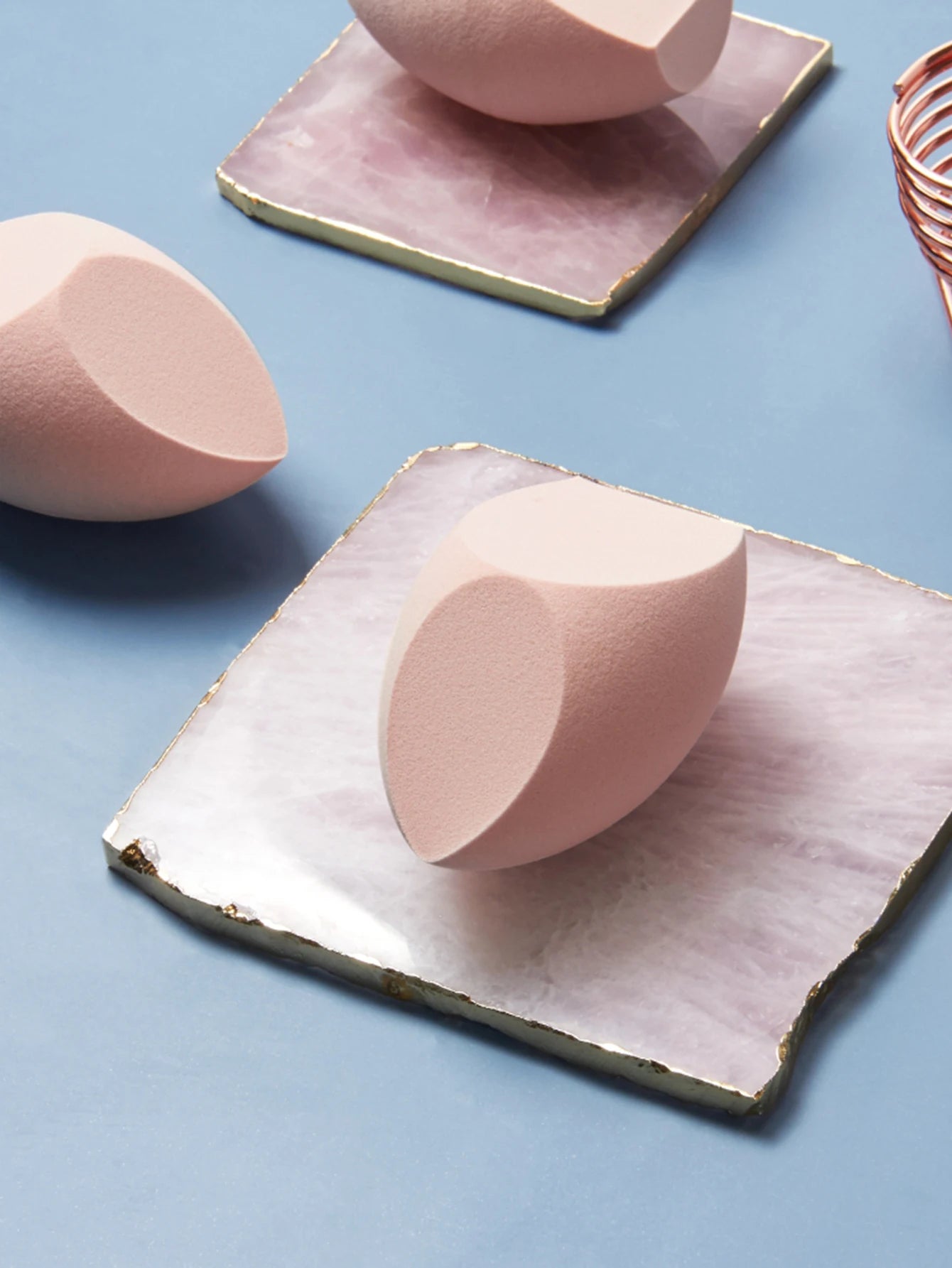 1 Pack Big Size Makeup Sponge Foundation Cosmetic displayed on a marble surface with soft pink tones.
