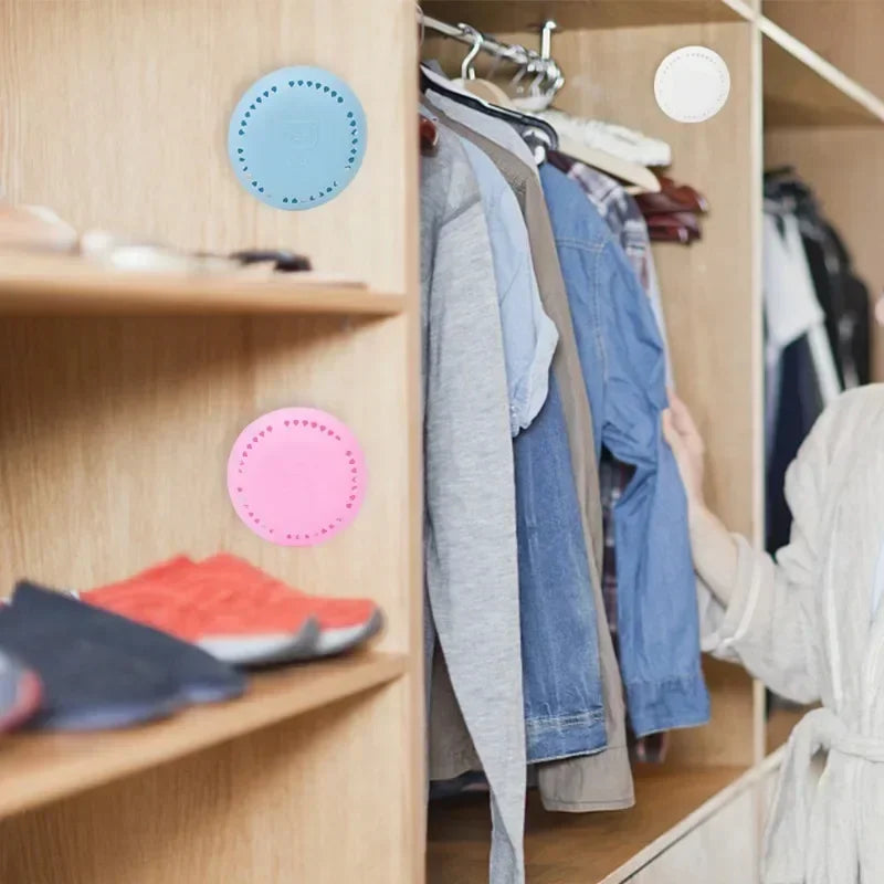 Home fragrance solid air freshener displayed in a modern closet with clothing and shoes.